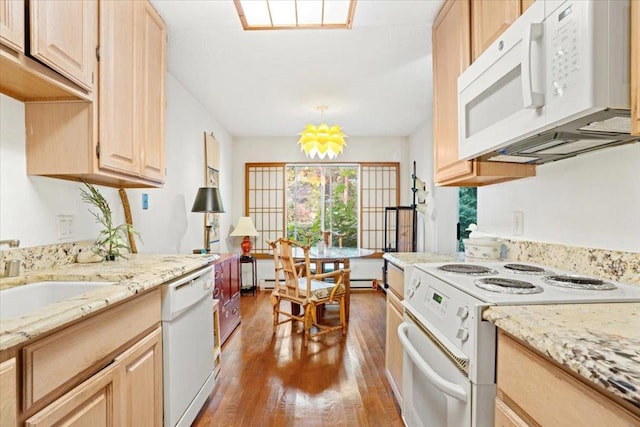 kitchen with white appliances, hardwood / wood-style floors, hanging light fixtures, an inviting chandelier, and light brown cabinets