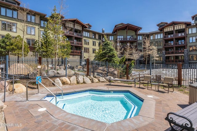 view of swimming pool with a patio