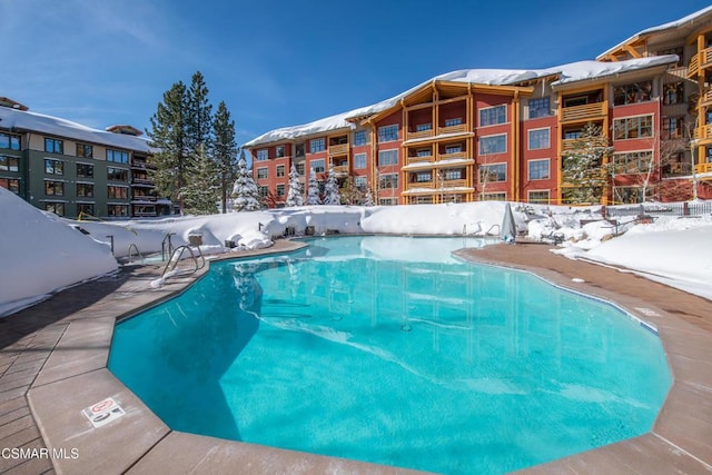 view of snow covered pool