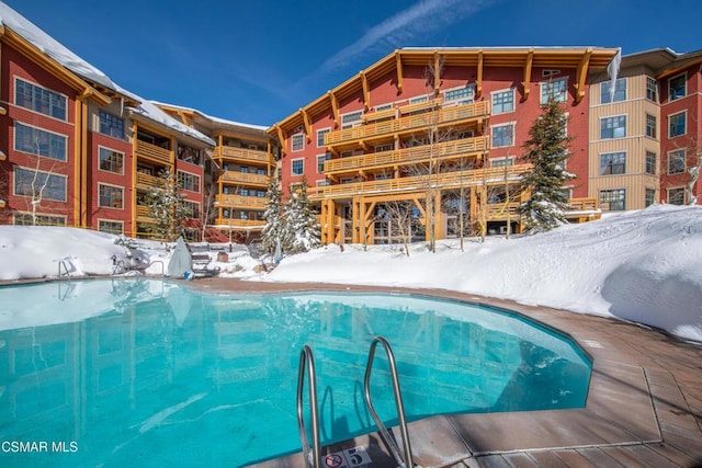 view of snow covered pool