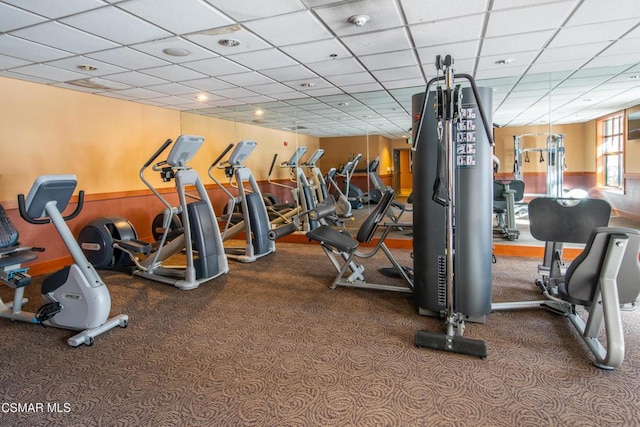 workout area featuring a drop ceiling