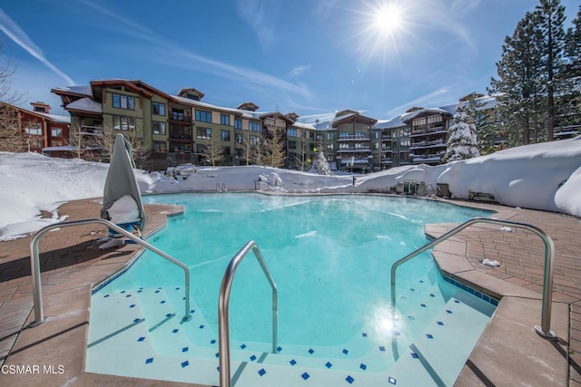 view of snow covered pool