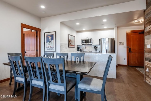 dining room with dark hardwood / wood-style floors