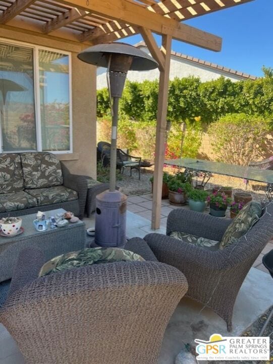 view of patio featuring a pergola and an outdoor hangout area