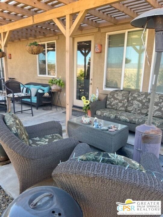 view of patio / terrace with outdoor lounge area and a pergola