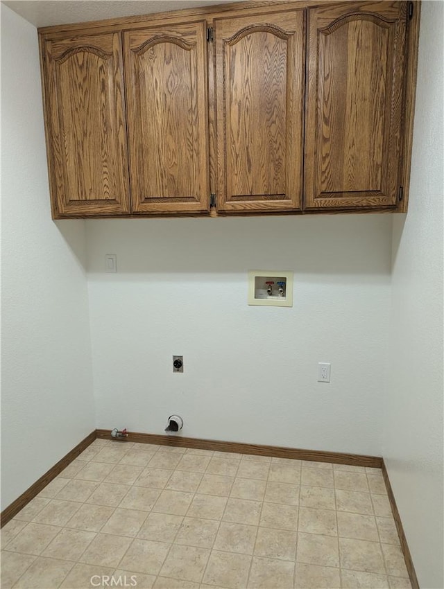 laundry room with baseboards, hookup for a washing machine, hookup for a gas dryer, cabinet space, and electric dryer hookup