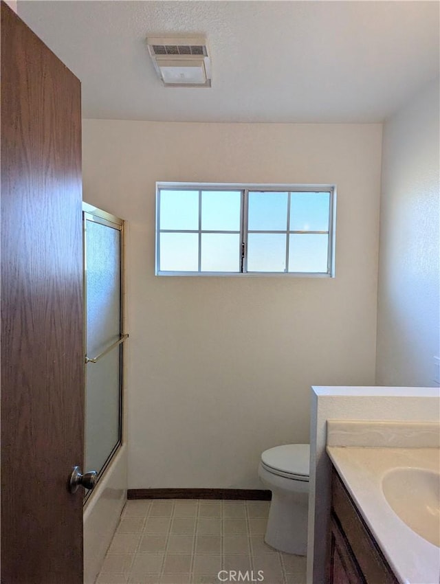 full bath featuring vanity, toilet, a healthy amount of sunlight, and visible vents