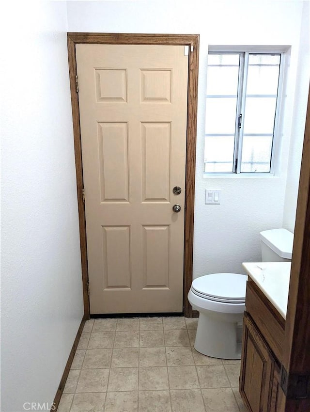 bathroom featuring toilet and vanity