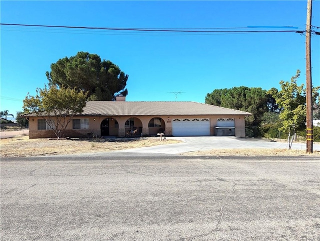 single story home featuring a garage