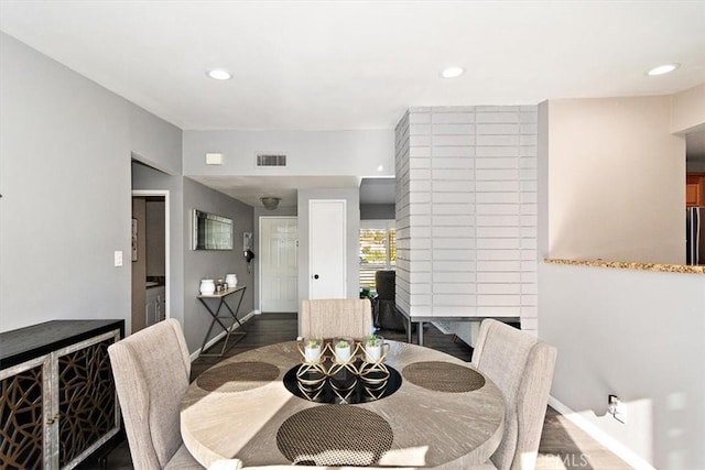 dining area with dark wood-type flooring