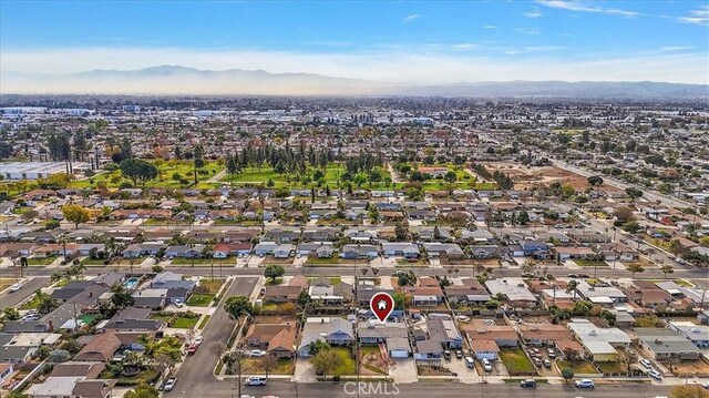 birds eye view of property with a mountain view