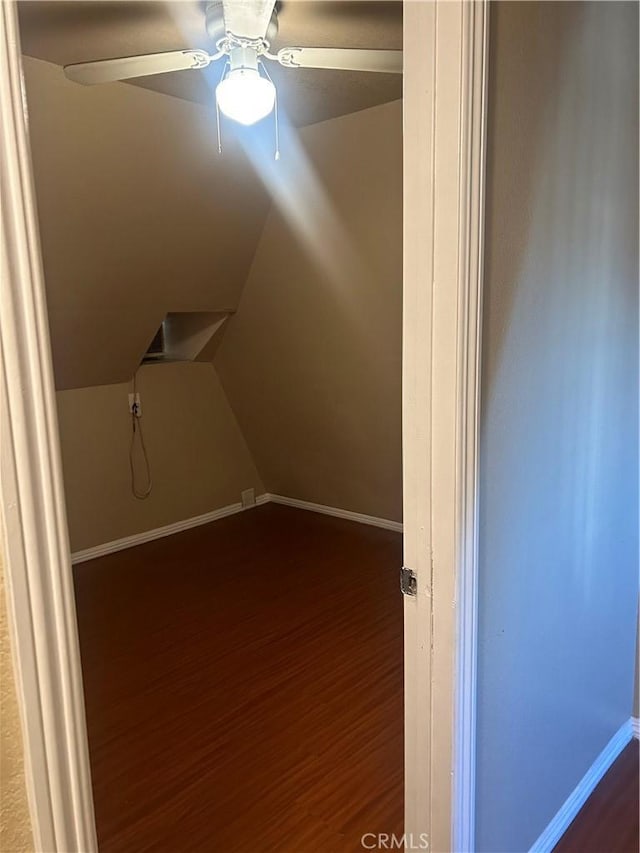 laundry room with ceiling fan and dark hardwood / wood-style floors