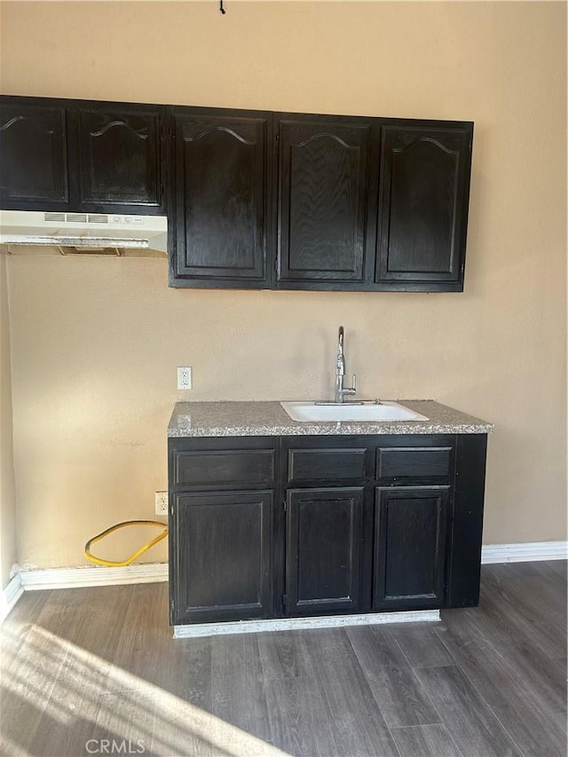 kitchen with dark wood-type flooring and sink