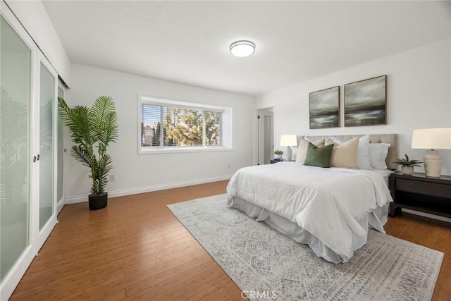 bedroom featuring dark hardwood / wood-style flooring