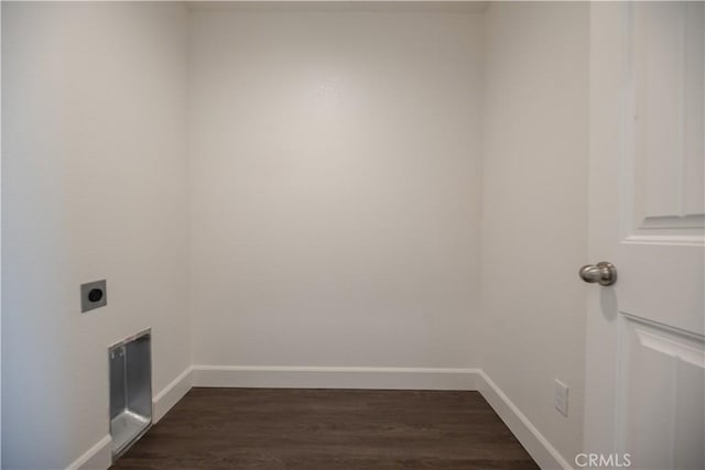 laundry room featuring dark wood-type flooring and electric dryer hookup