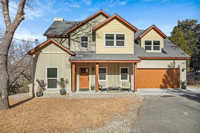 view of front of property featuring a garage and covered porch