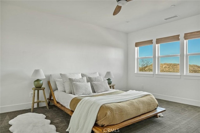 carpeted bedroom featuring ceiling fan