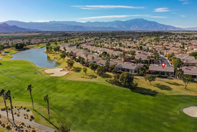 drone / aerial view featuring a water and mountain view