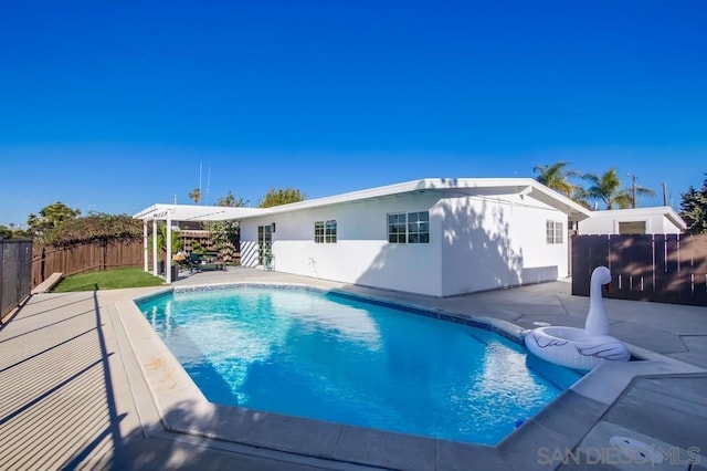 view of swimming pool featuring a patio area