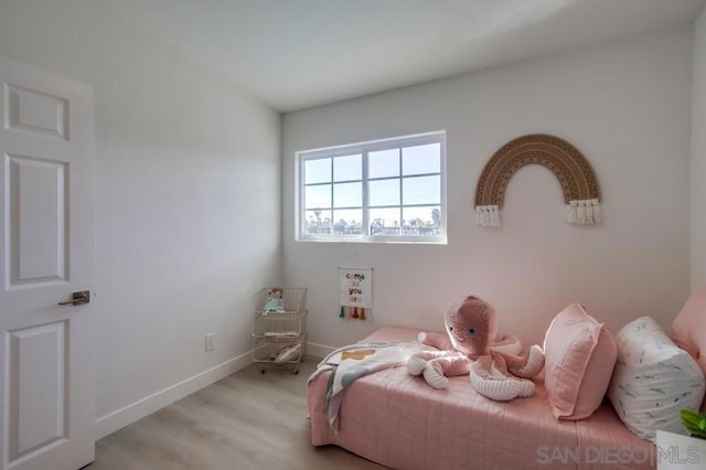 bedroom with light wood-type flooring