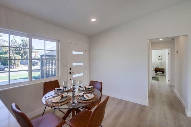 dining area featuring light wood-type flooring