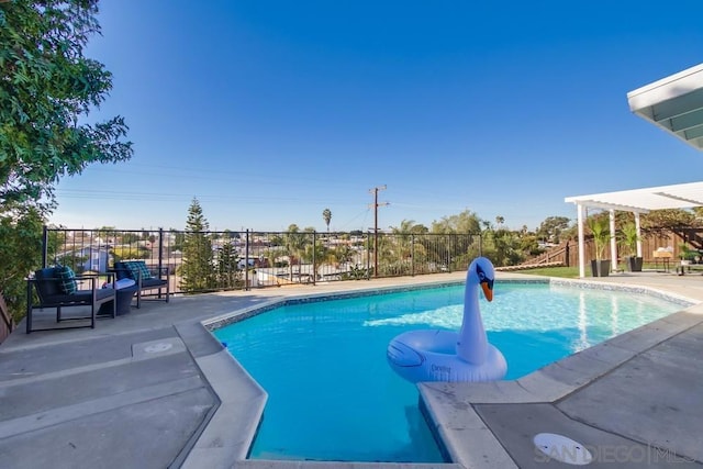 view of swimming pool with a patio