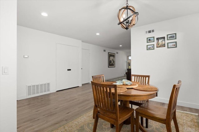 dining area with hardwood / wood-style flooring