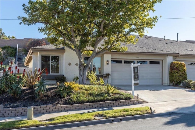 ranch-style home featuring a garage