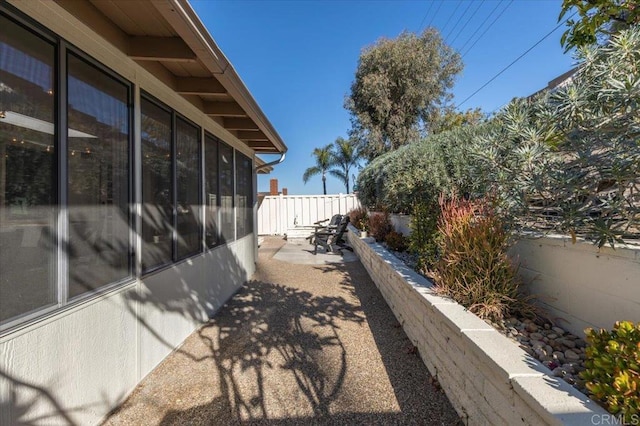 view of side of property featuring a patio area