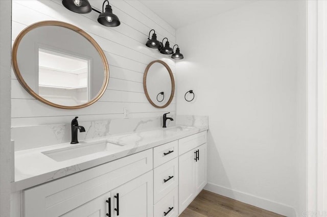 bathroom featuring vanity and hardwood / wood-style flooring