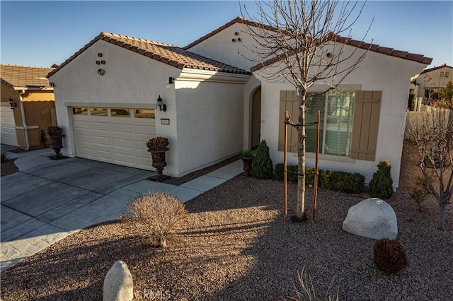 mediterranean / spanish house with a garage