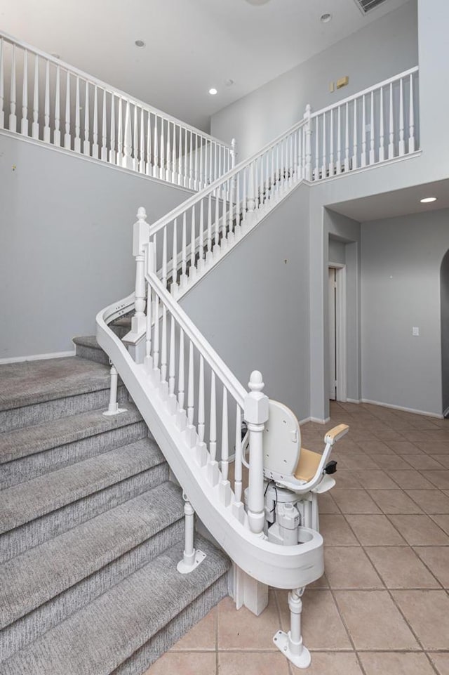 staircase with tile patterned floors