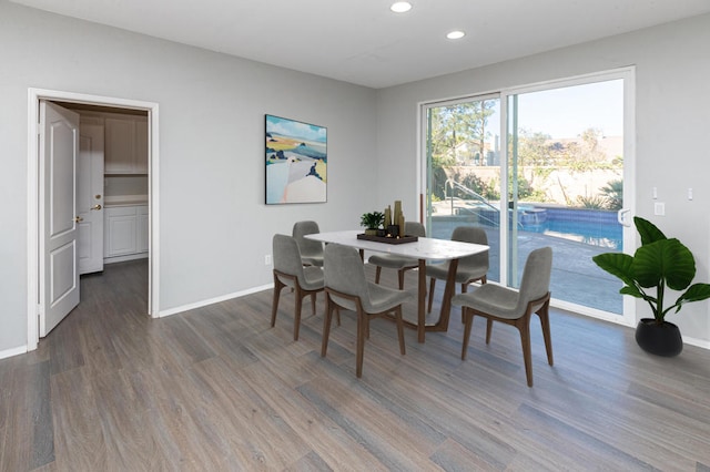 dining space featuring dark hardwood / wood-style flooring