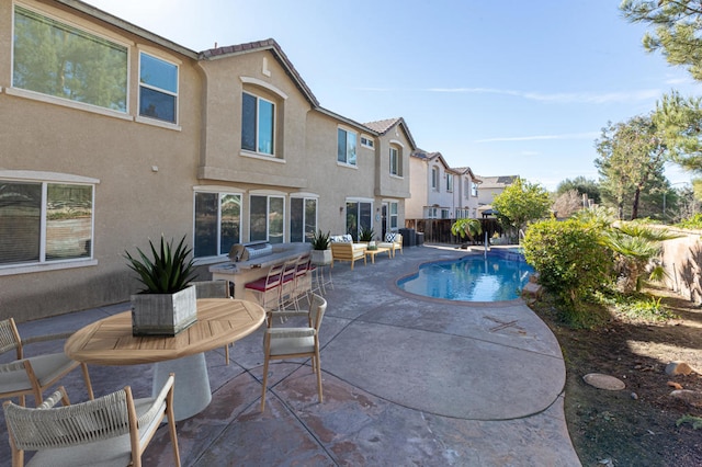 view of swimming pool with a patio