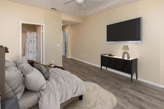 bedroom with ceiling fan and wood-type flooring