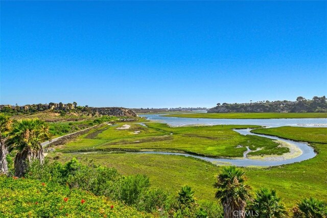 view of home's community with a water view