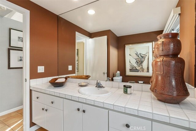 bathroom featuring vanity and tile patterned flooring