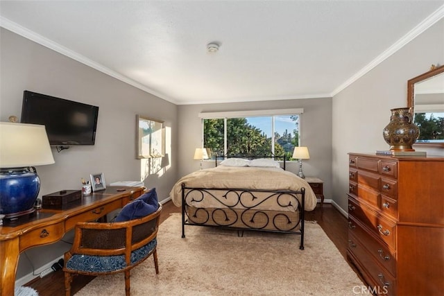 bedroom with crown molding, light wood-style flooring, and baseboards