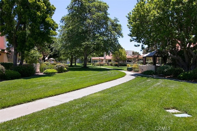 surrounding community with a yard and a gazebo