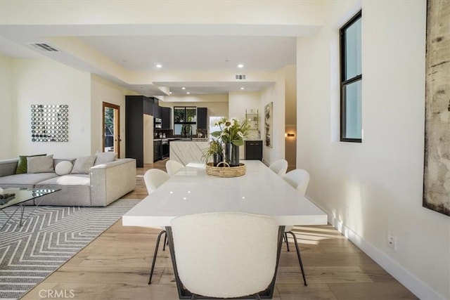 dining area with light hardwood / wood-style flooring