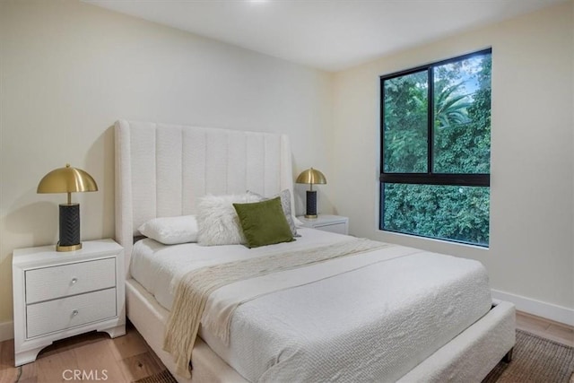 bedroom with hardwood / wood-style flooring