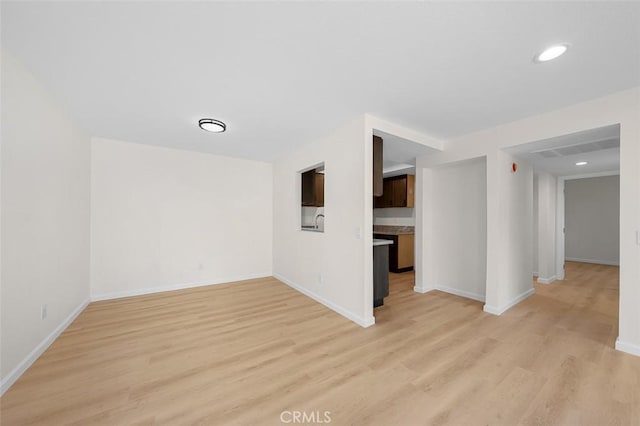 spare room featuring light hardwood / wood-style flooring