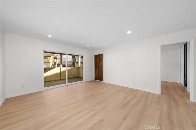 unfurnished room with light wood-type flooring