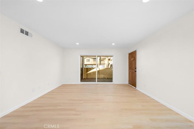 unfurnished room with light hardwood / wood-style flooring