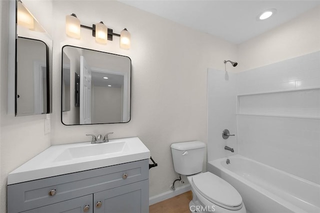 full bathroom featuring shower / tub combination, vanity, and toilet