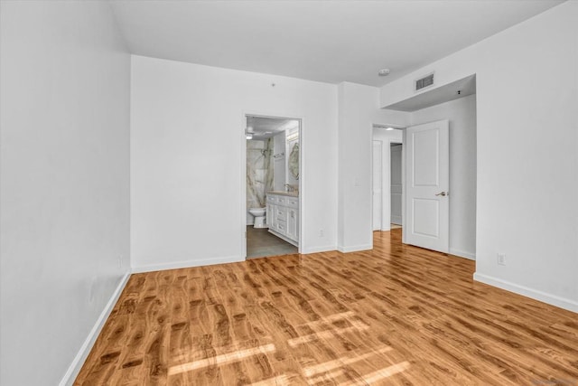 unfurnished room with light hardwood / wood-style floors