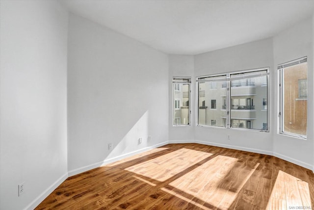 empty room featuring hardwood / wood-style flooring