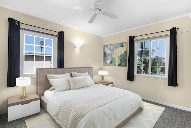 bedroom featuring ceiling fan, carpet, and ornamental molding