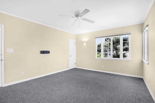 carpeted empty room featuring ceiling fan