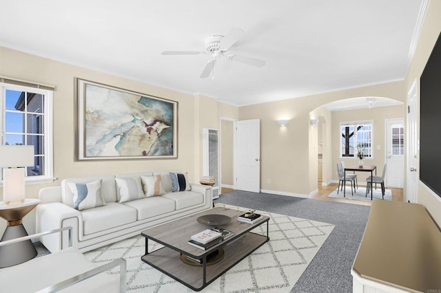 carpeted living room featuring ceiling fan